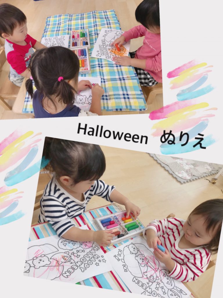 ハロウィンの塗り絵で遊ぶ園児たち