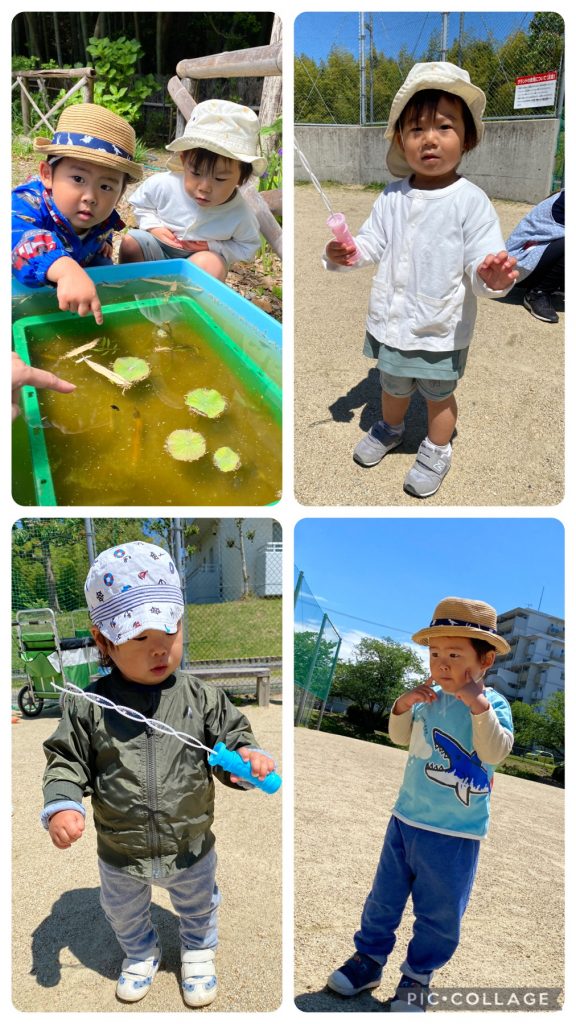 公園でシャボン玉をする園児たち